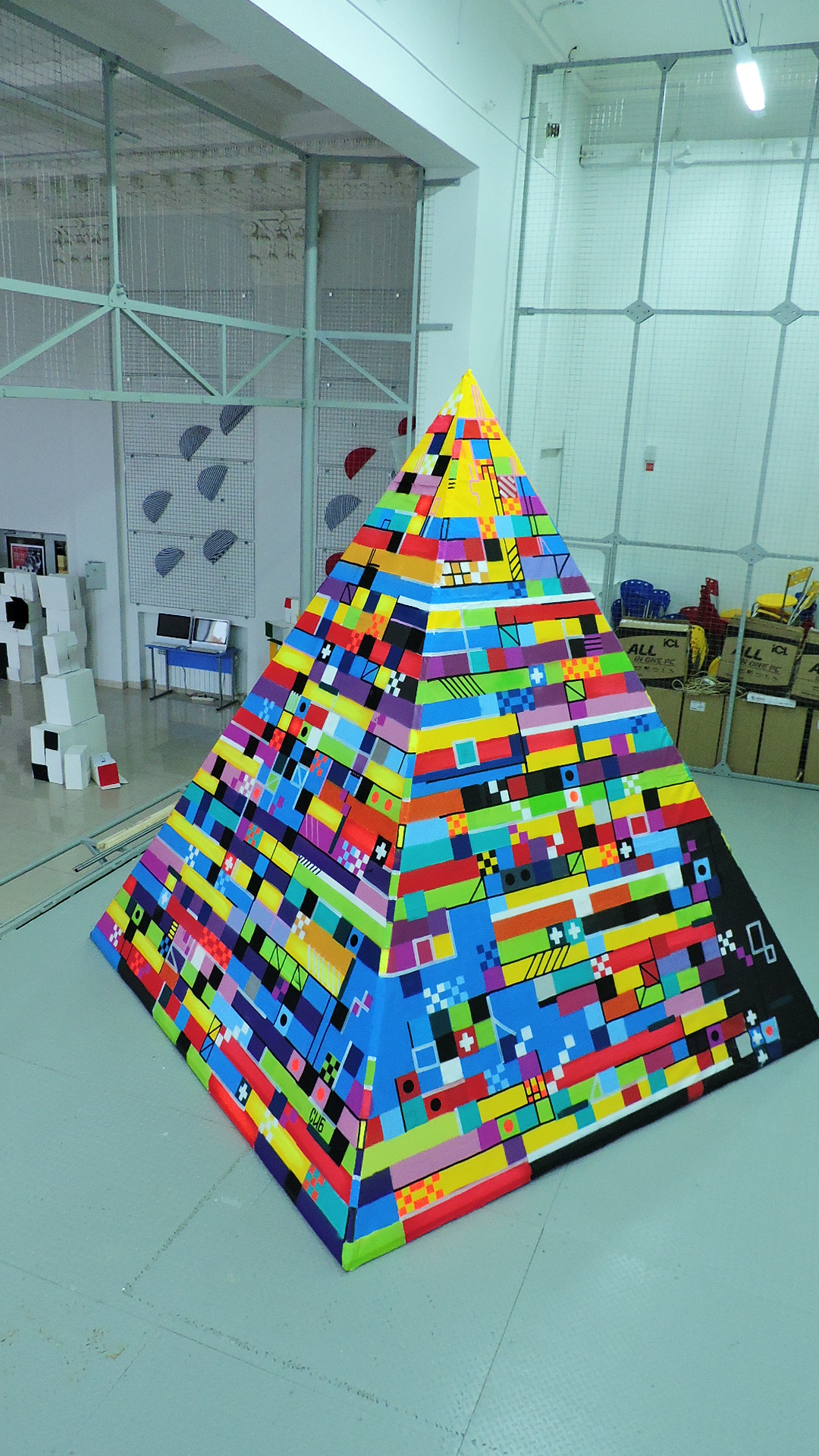 The pyramid is assembled from a rigid frame and PVC fabric.