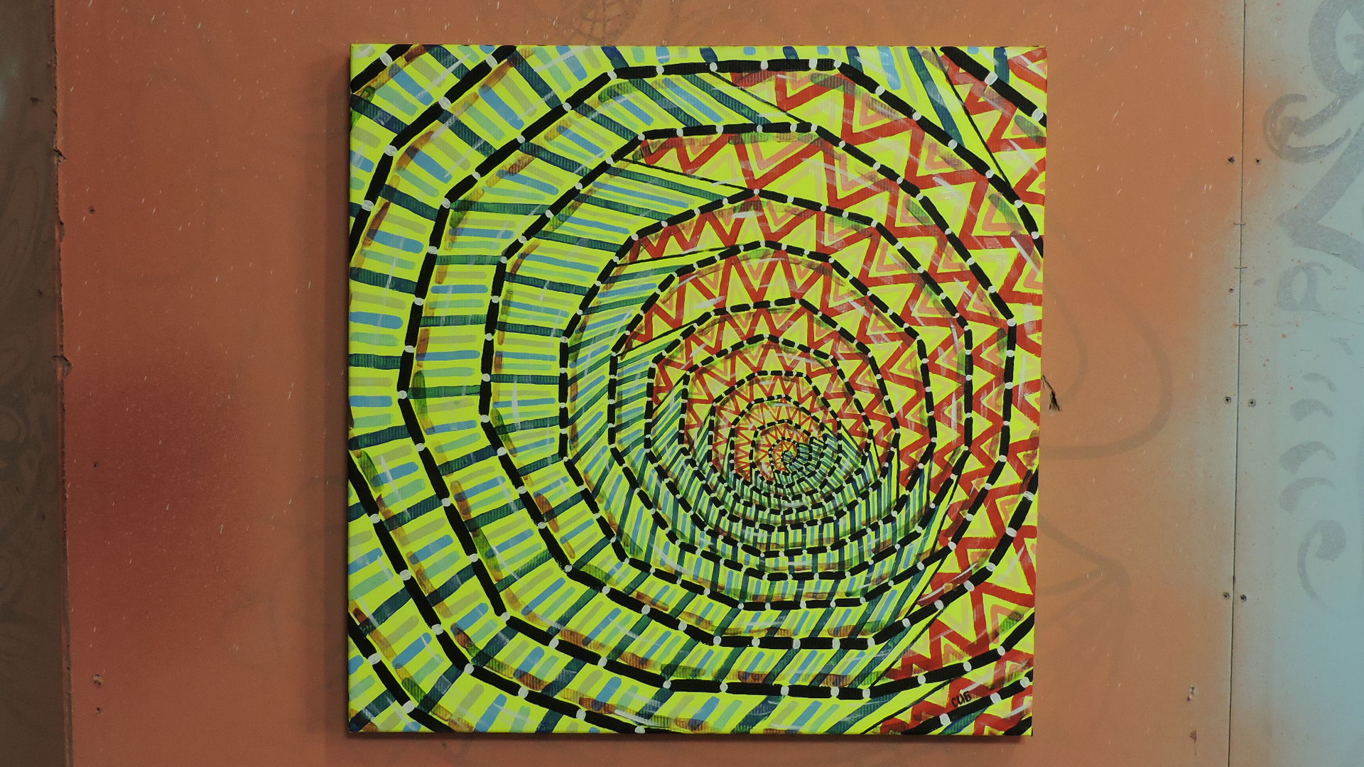 On the canvas painted a bright spiral on a fluorescent yellow background